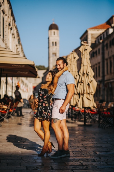 Portrait of a couple at Stradun main Street in the Old town of Dubrovnik, morning light