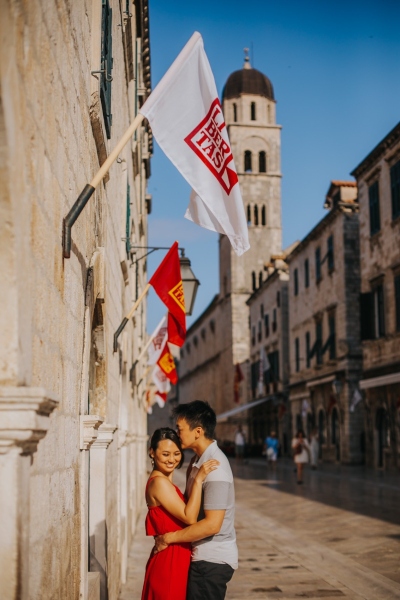 Portrait of a couple at Stradun main Street in the Old town of Dubrovnik, morning light