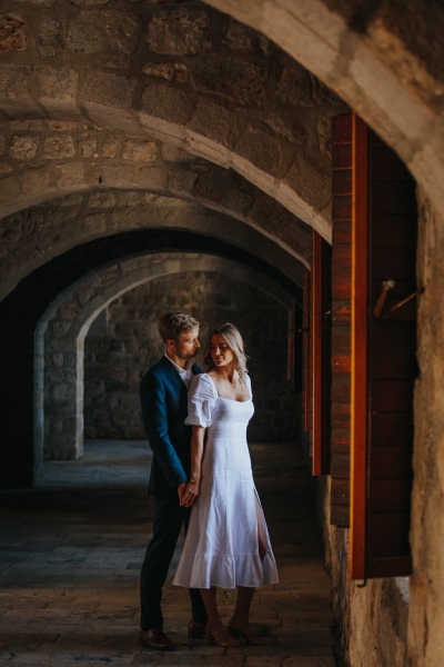 St. Lawrence fortress in Dubrovnik, just married couple on a morning photo shoot, low light art