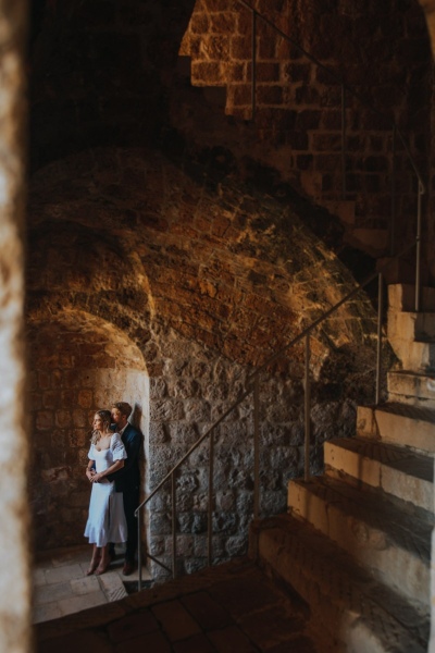 Romantic photo of a couple at st. Lawrence fortress in Dubrovnik during the morning couple photo shoot. Low light, art