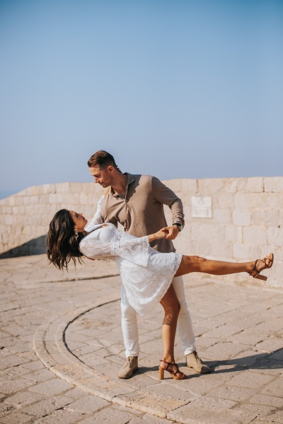 Couple dancing at st. Lawrence fortress in Dubrovnik on a morning photo shoot