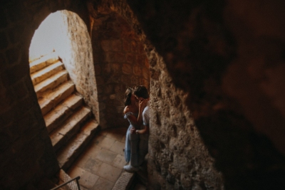 Romantic photo of a couple at st. Lawrence fortress in Dubrovnik during the morning couple photo shoot. Low light, art