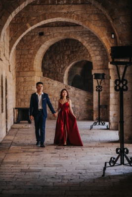 St. Lawrence fortress in Dubrovnik, couple on a morning photo shoot, lovely red dress