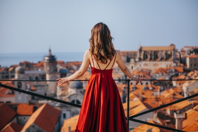 Portrait of a woman in red dress at Dubrovnik City walls, Game of Thrones