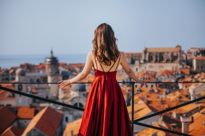 Portrait of a woman in red dress at Dubrovnik City walls, Game of Thrones
